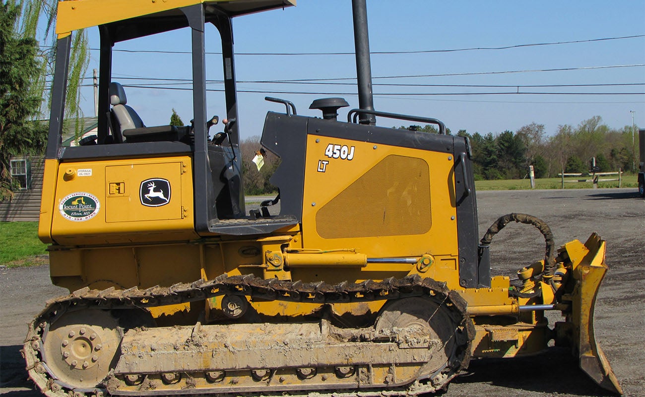 Deere dozer on property