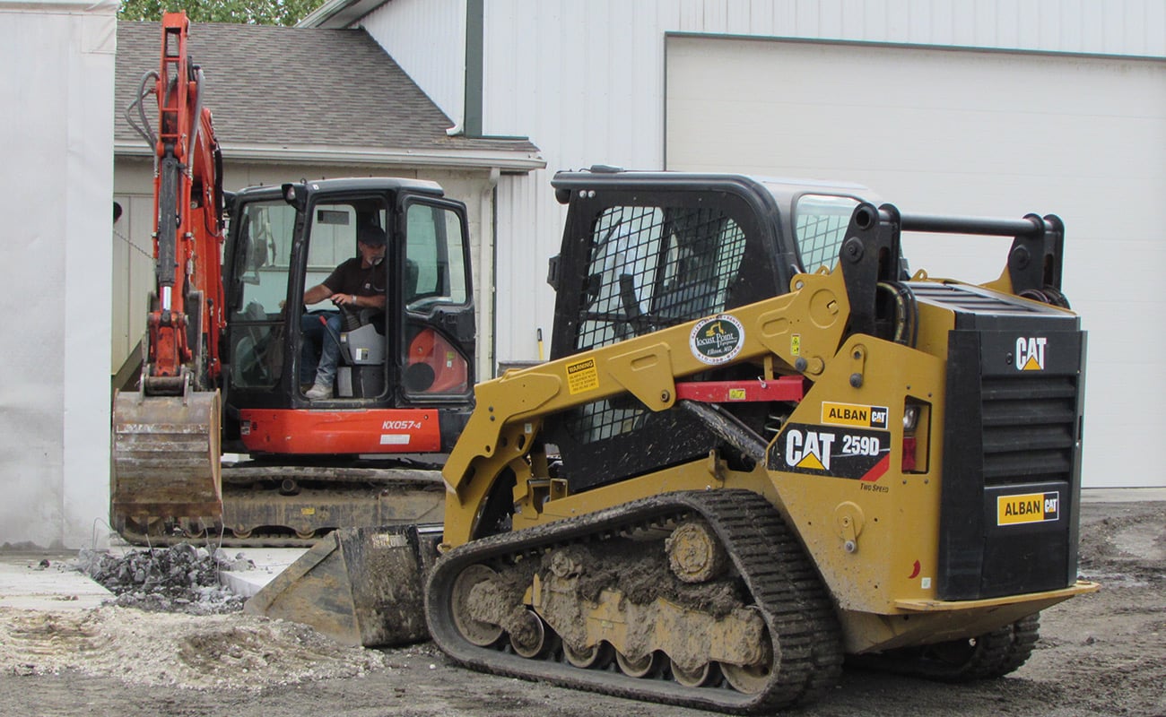 Kubota mini excavator and CAT skid steer